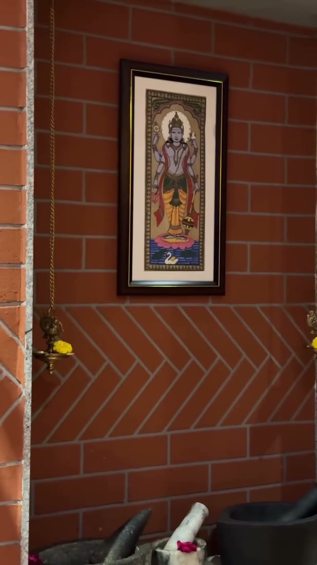 Ayurveda clinic deity art on brick