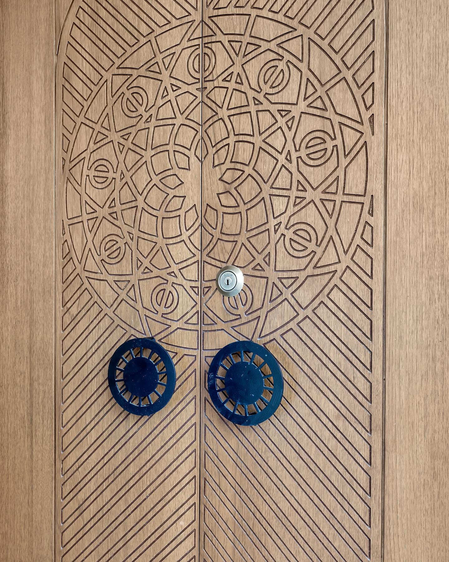 Custom carved mandala main door with blue handles