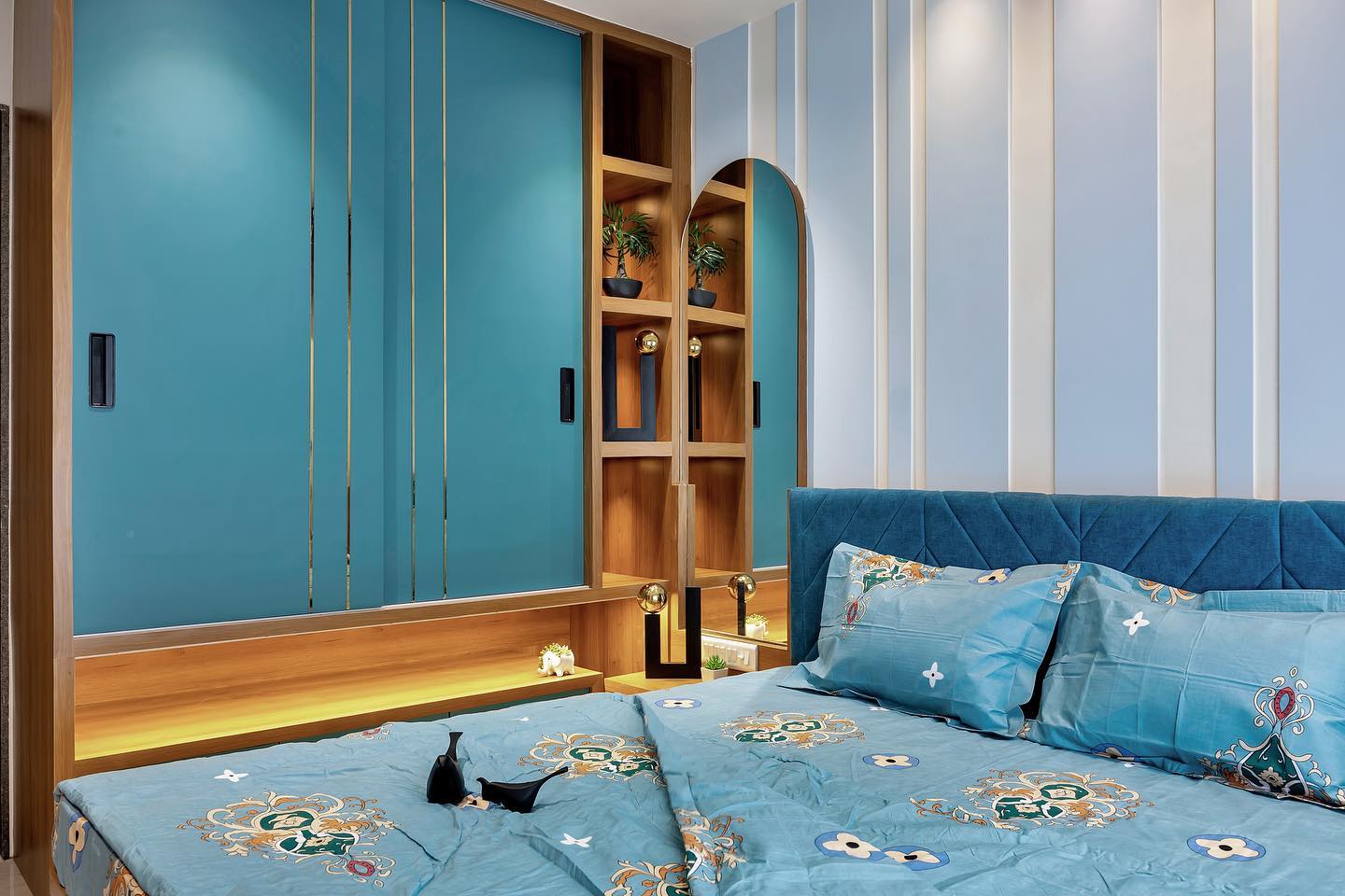 Living room with blue sofa and arched wood shelving